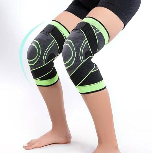 Person wearing black knee sleeves with green accents on a white background